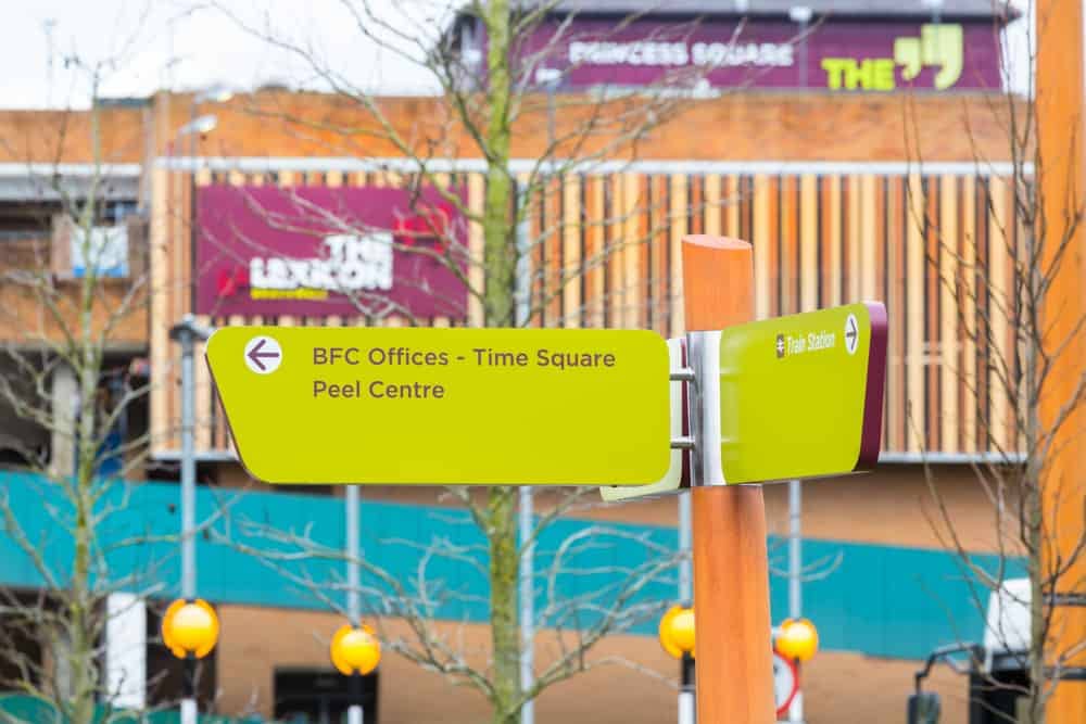 Close up of the directional prompt signs designed as part of The Lexicon, Bracknell wayfinding scheme. Showing the layout of the content and the construction of the fingerpost signs