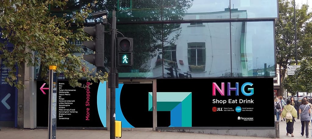 Black vinyl hoarding, with a large pink, purple, blue and green lettering applied to the glass in an empty shop front in Notting Hill Gate