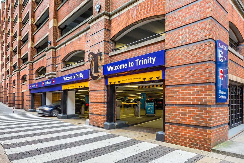 Welcome signs and external branding at the entrance to the Trinity Leeds car park