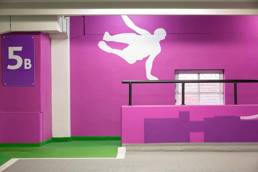 Large Parkour supergraphic that plays off the handrail barrier on level 5b of the Boar Lane car park in Leeds