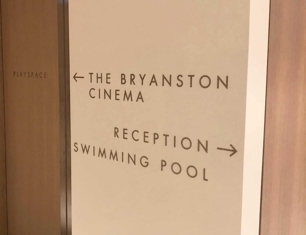 Directional wayfinding signs in Bryanston Apartments
