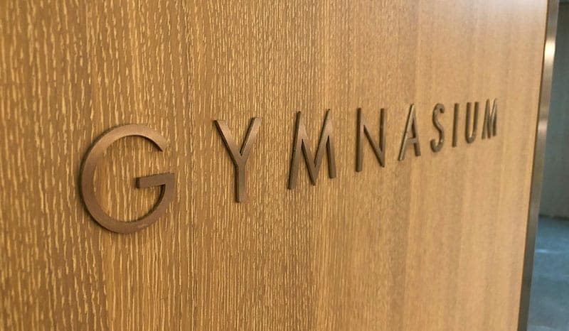 Door sign to the gymnasium in Marble Arch Place apartments