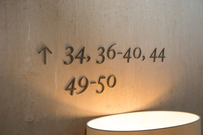 Example of apartment directional information applied as individual numbers and symbols to the wall