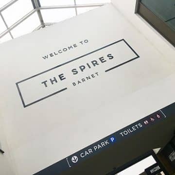 Welcome sign at the entrance to the Spires Shopping Centre in Barnet